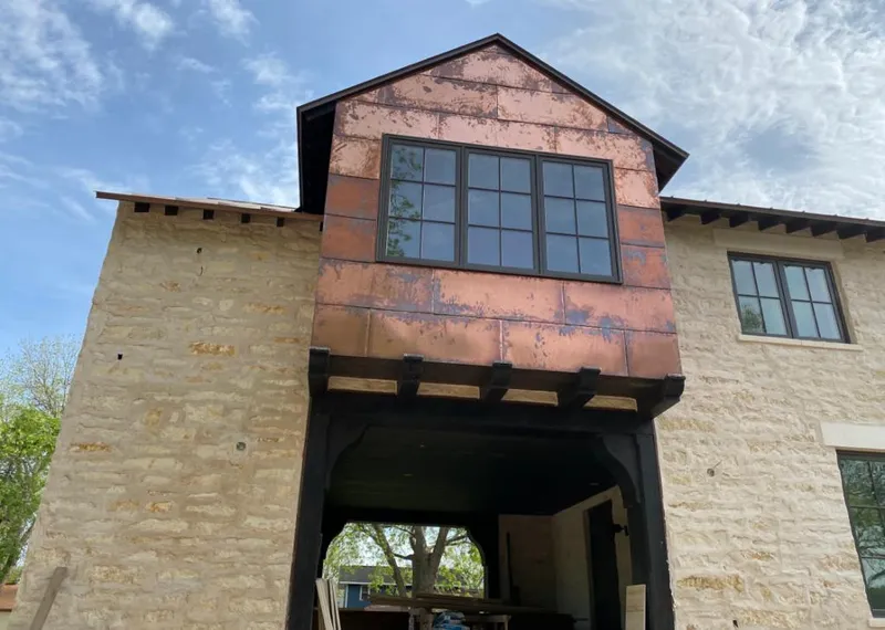 Copper metal panel facade on a stone building for Skylight Installation in Whitemarsh