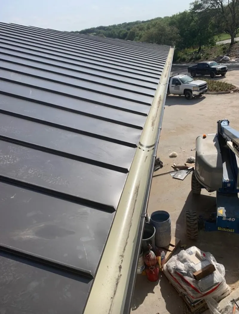 Standing seam panel and gutter detail on a metal roofing jobsite in Whitemarsh